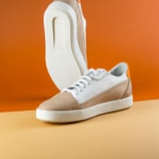 Image of two tan shoes shown from side and bottom